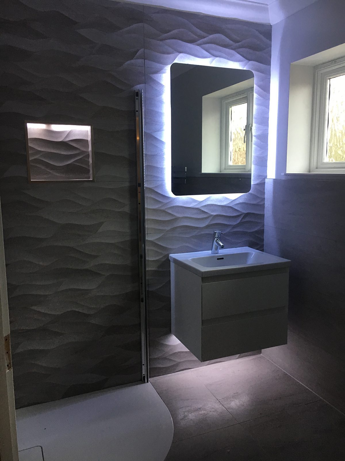 The Cambridge Bath Co bathroom mirror and sink with lighting
